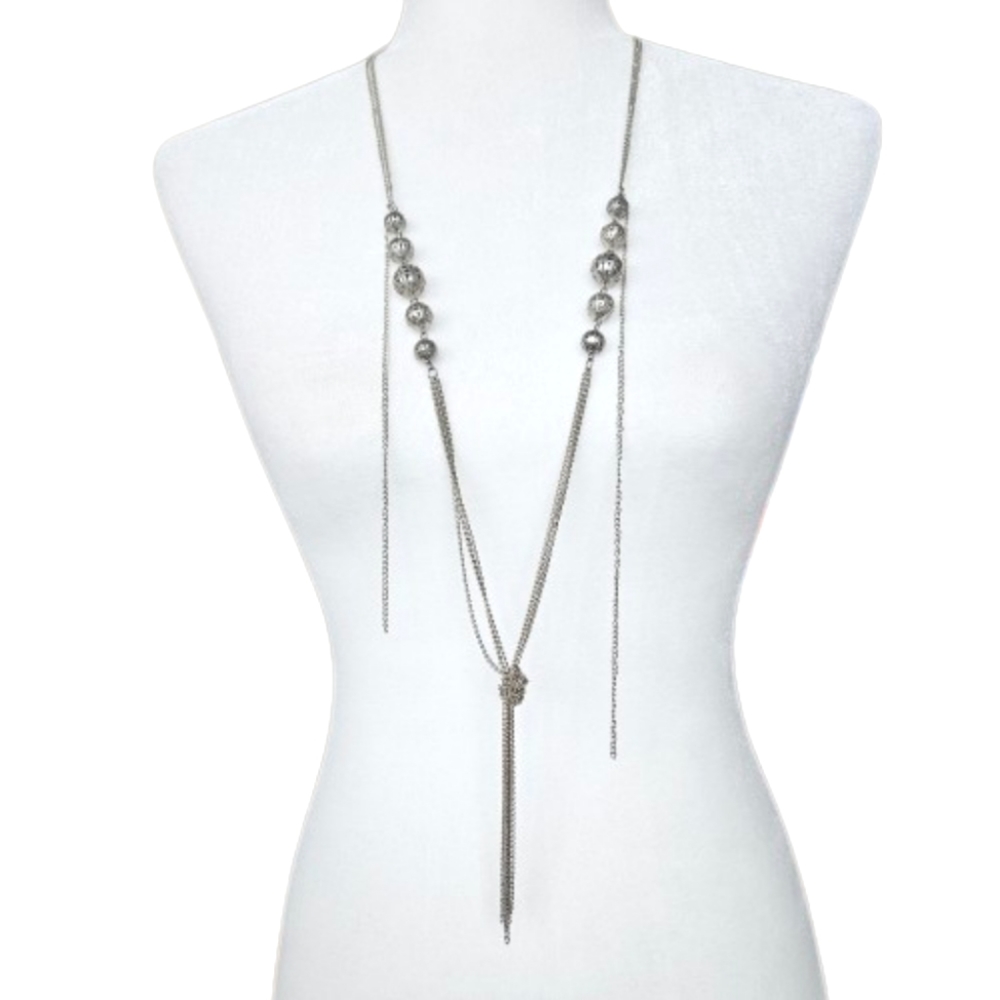 2/$30 Long silver tone Y necklace with hollow filigree balls, and knot & tassel